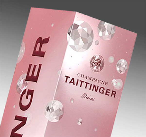 a soft pink rectangular package with diamond shaped imagery and black text reading “Taittinger” made using sustainable Incada stock package board.
